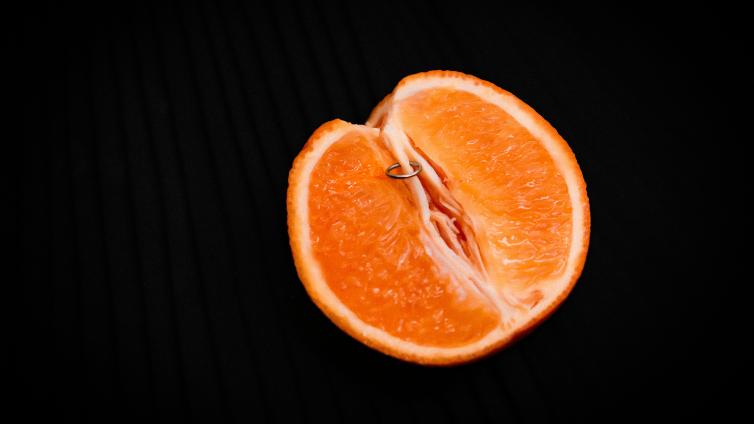Orange with piercing